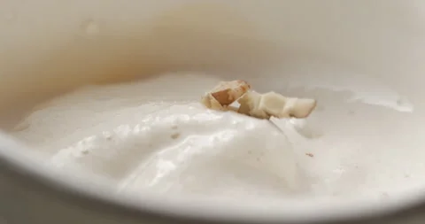 Milkshake with nuts macro rotating studio 4K Stock-Footage 144800248
