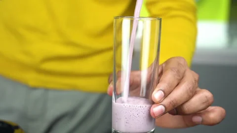 A milkshake is poured into a glass Video stock 135516133