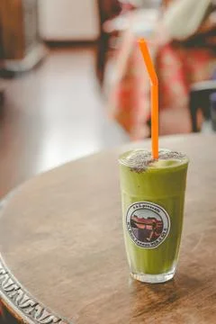 Milkshake of spinach, banana, mango, soymilk, soy protein, ice, chia servedn  Stock Photos