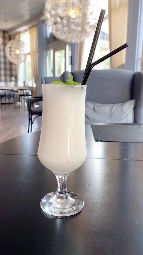 Milkshake with a straw. Vertical video Stock Footage 281512918