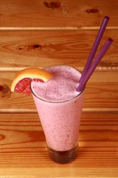 Milkshake on wooden background Stock Photos