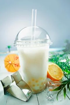 Milky bubble tea with fruit and boba balls Stock Photos
