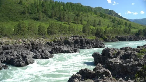 Milky rapid mountains river flow through volcanic rocks Stock Footage 113139710