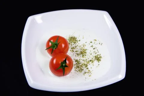 Milky soup with tiny red tomatoes イラスト素材