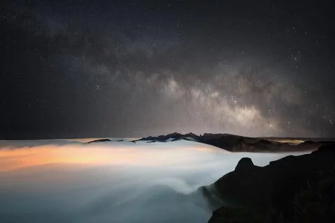 Milky way above cloud inversion - tinted orange by the ight pollution below7 Stock Photos