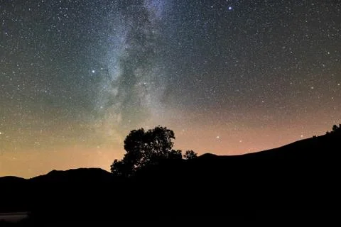 Milky way above a tree un Ullswater Stock Photos