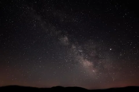 Milky Way forms a classic diagonal over the horizon Stock Photos