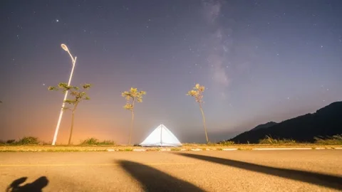 Milky Way Galaxy Time-lapse over Glowing Camping Tent in Wilderness Stock Footage 326678615