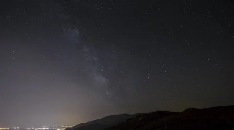 Milky way over mountains near Bastia time-lapse Stock Footage