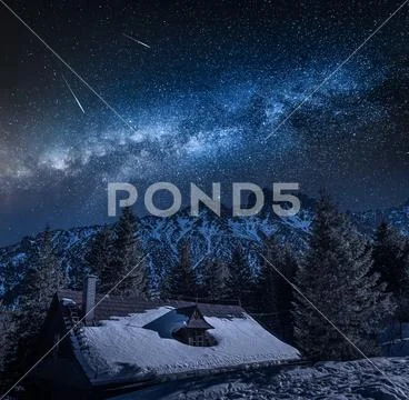 Milky way over old mountain shelter by sea eye lake Stock Photos