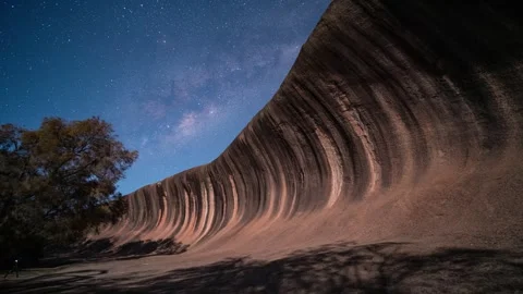 Milky way rising Wave rock, Hyden Western Australia 4K Video timelapse Stock Footage 297583369