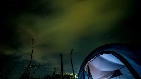 Milky Way in Time Lapse with clouds near tent at night Vídeos de archivo 112328502