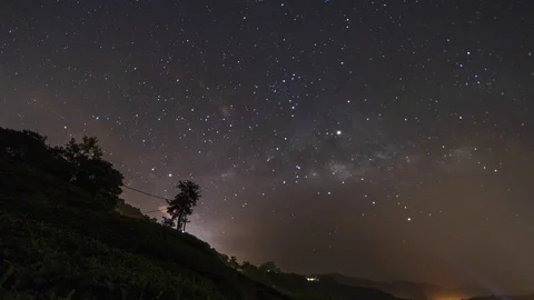 Milky way time lapse scenery in the middle of the night at tea farm plantation Stock Footage 105328216