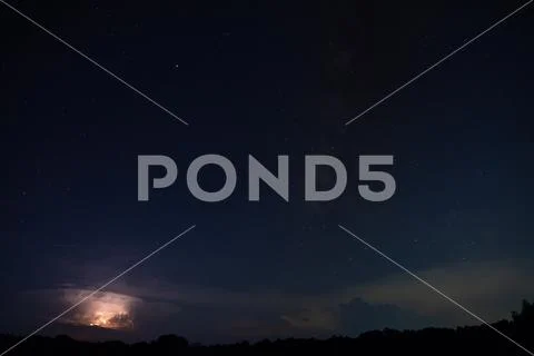 Milkyway and Lightning Sky at night Stock Photos