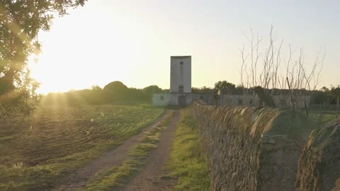 Mill and rustic house at dawn on a plot of land in the interior of the island Stock Footage 144403581