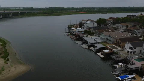 Mill Basin NYC Waterfront Aerial – Overcast Summer Drone Shot – ProRes 422HQ Stock Footage 312041953
