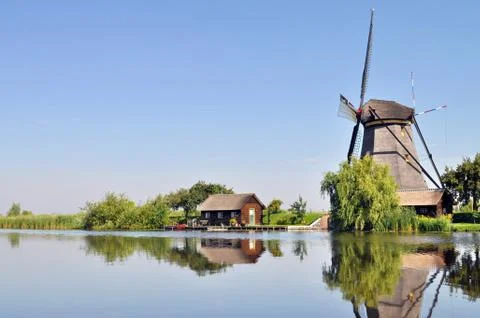 Mill on canal Stock Photos