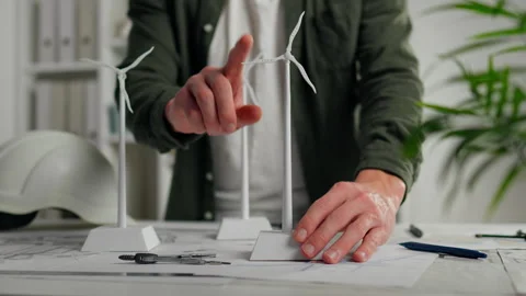 Mill. Girl worker confidently Movement of a wind generator mill Model of a w Stock Footage 250273353