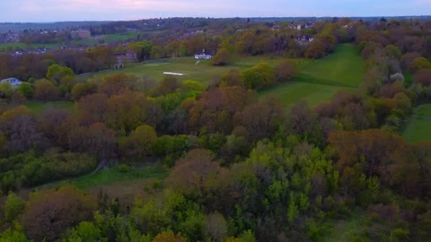 Mill Hill aerial drone view panning down towards parks and woodland 4k Stock Footage 153440795