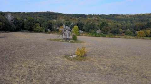Mill with lonely tree on field. Stock Footage 163089837