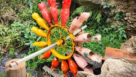 Mill made of plastic colored bottles. The concept of plastic recycling, environm Stock Footage 282718776
