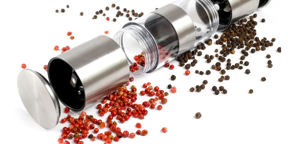 Mill for pepper on a white background Foto stock