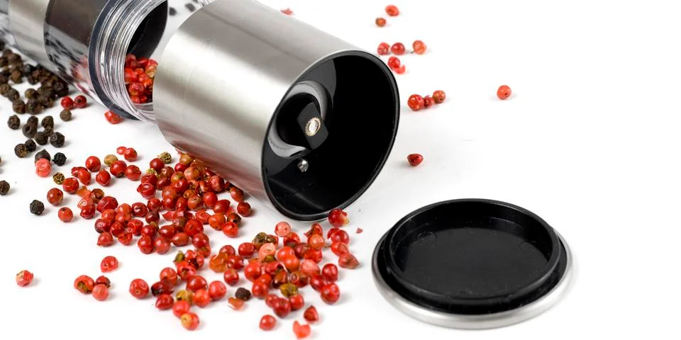 Mill for pepper on a white background Stock Photos