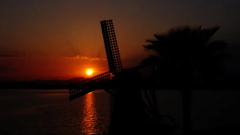Mill silhouette on beach in evening. Stock Footage 246876066