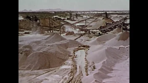 A mill worker tries to loosen material in a hopper, and is killed when loose Stock Footage 79429705