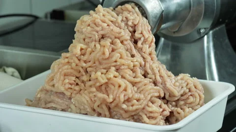 Milled poultry or rabbit climbs through a food processor, the process of cooking Stock Footage 100735529