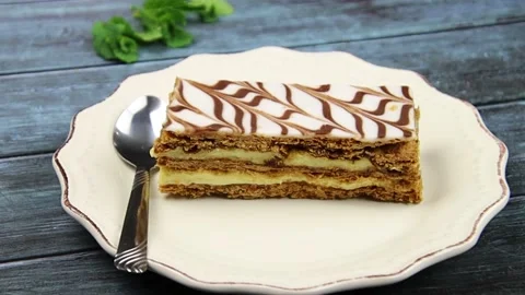 Millefeuille in a plate on a table Stock Footage 169159117