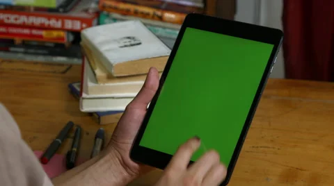 Millenial Girl using a green ipad Stock Footage 59779061