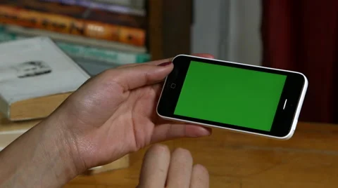 Millenial Girl using a Green Screen Smart Phone Video stock 59783053