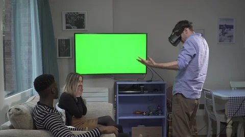 Millenials on VR headset sword lightsaber fight Stock Footage 89922064