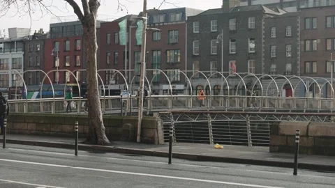 Millenium bridge dublin with light traffic and people crossing Video stock 170669715