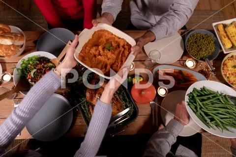 Millennial adult friends celebrating Thanksgiving together at home Stock Photos