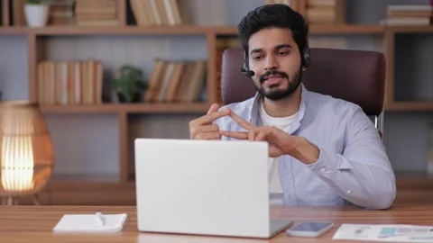 Millennial arab freelancer man in casual sitting at work desk in front of lap Stock Footage 238539627