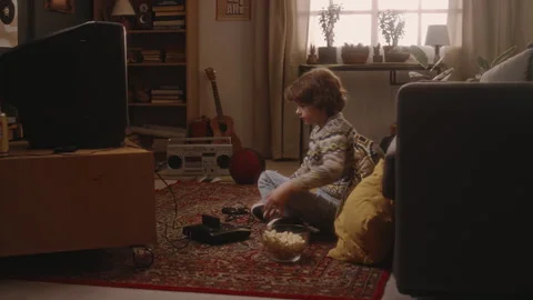 Millennial Boy Starting Playing Console Video Game on Tube TV in 90s 스톡 동영상 273740766