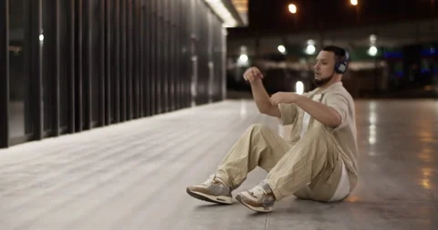 Millennial break dancer on pavement in city Stock Footage 244474239