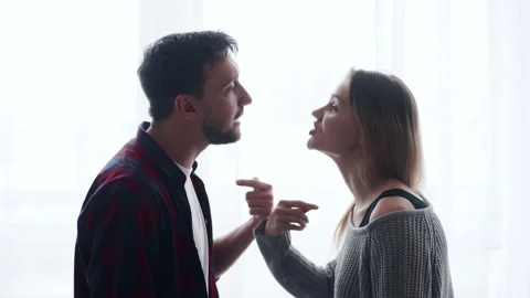 Millennial couple arguing shouting blaming each other of problem, frustrated Stock Footage 221089229