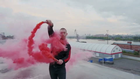 Millennial extraordinary man keep smoke torches in his hand and practice vogue Stock Footage 105463358