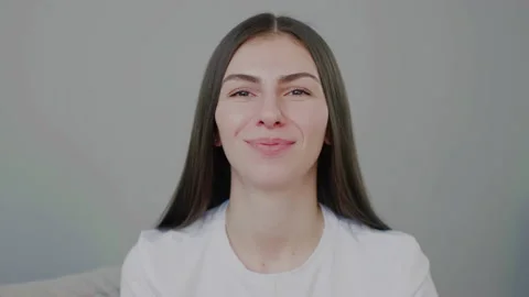 Millennial girl showing hello gestures waving her hands and blowing kiss Stock Footage 149905341