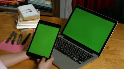Millennial Girl using a Green Screen ipad and macbook pro Stock-Footage 59780474
