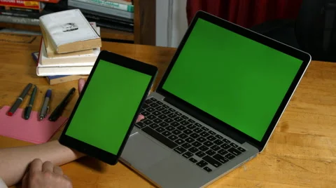 Millennial Girl using a Green Screen ipad and macbook pro Stock Footage 59780485