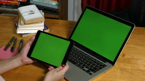 Millennial Girl using a Green Screen ipad and macbook Stock Footage 59781330