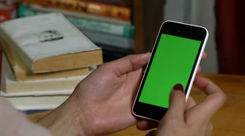 Millennial Girl using a Green Screen iphone Stock Footage 59782057
