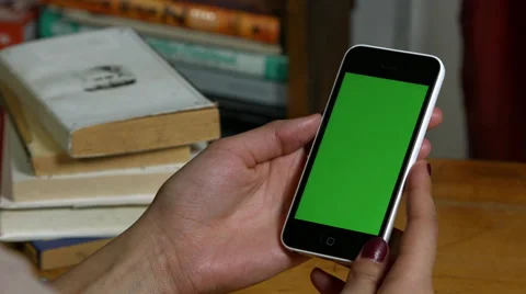 Millennial Girl using a Green Screen iphone Stock Footage 59782153