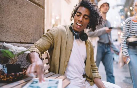 Millennial hipster guy searching web application for browsing wireless in social Stock Photos