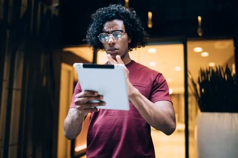 Millennial hipster guy using digital tablet for banking Stock Photos