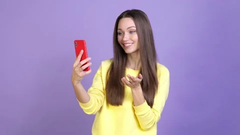 Millennial lady answer video call gadget isolated bright color background Video stock 169997225